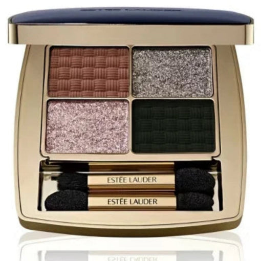 Estée Lauder Four-Way Quad Eye Shadow Money Moves palette with four square pans in brown, silver, pink, and dark green shades, housed in a gold-toned case with a navy blue lid, shown open with two applicators.